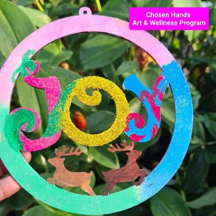 The painted Joy Christmas ornament from the Chosen Hands Art and Wellness Program